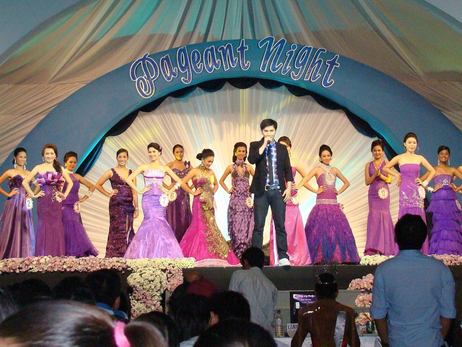 Candidates in purple and pink gowns on stage at the 2010 Sinadya sa Halaran pageant night in Roxas City